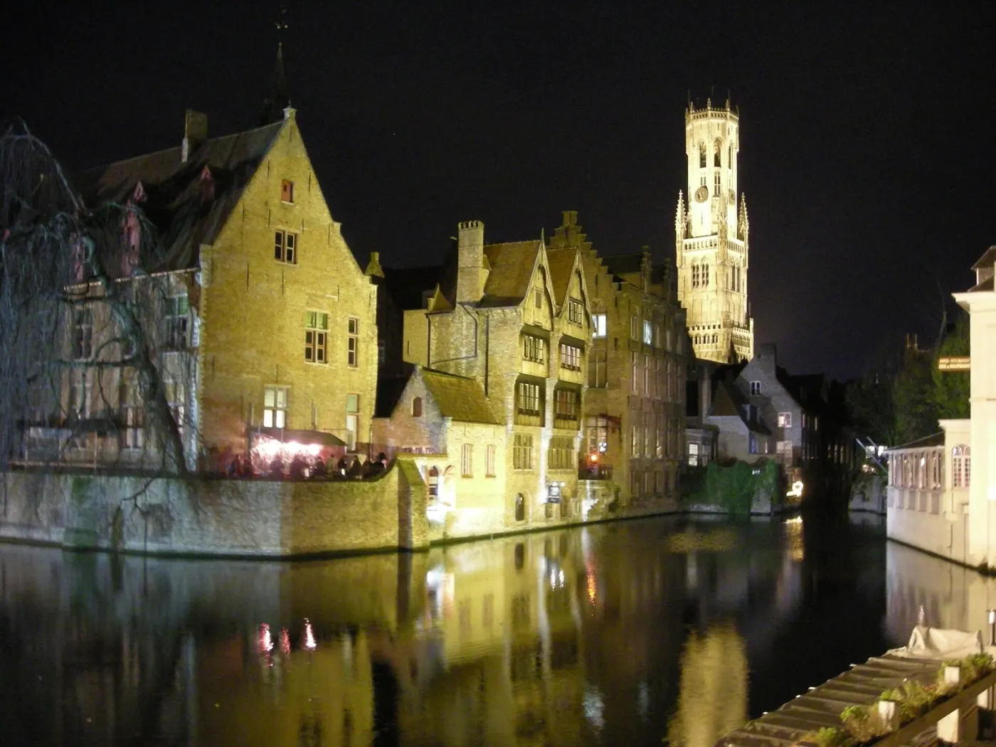 Rozenhoedkaai at night, the lit Belfry reflected in the canal